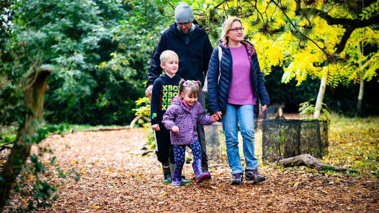 A family explores the pleasure grounds at Wimpole Estate, Cambridgeshire
